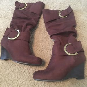Knee high brown boots with gold accents